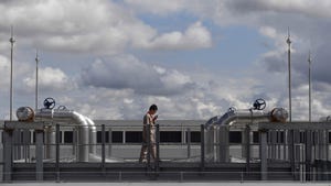 An engineer examines a hybrid cooling data center tower