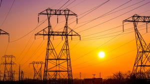 Electric towers with power lines at sunrise, Pennsylvania, USA