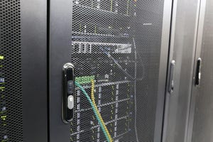 Electronic lock on server rack in data center. Server room, computer network security