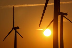 wind turbines at sunset