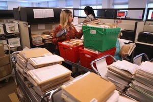 piles of paperwork in an office