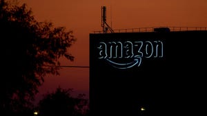 Amazon logo on a building at dusk