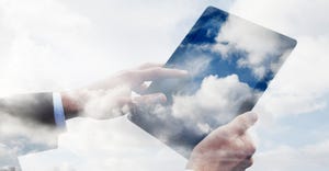 worker using tablet filled with clouds