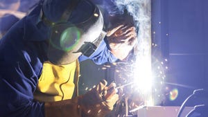 A man welding in a data center construction project.