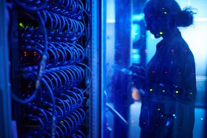 Woman working in a server room