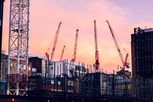 Evening cranes over a data center construction site