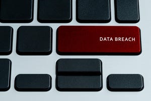 Data Breach on laptop keyboard. Isolated text on theme of internet security.