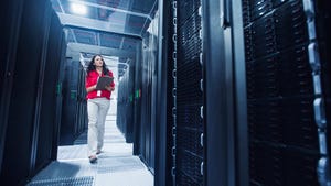 Woman in a data center server room